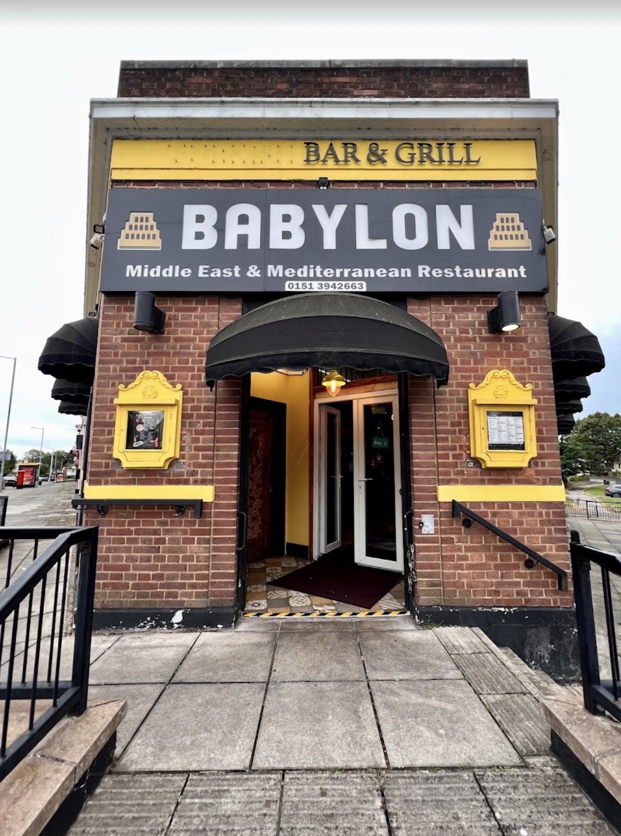 Babylon restaurant entrance and sign at 181 Old Chester Road